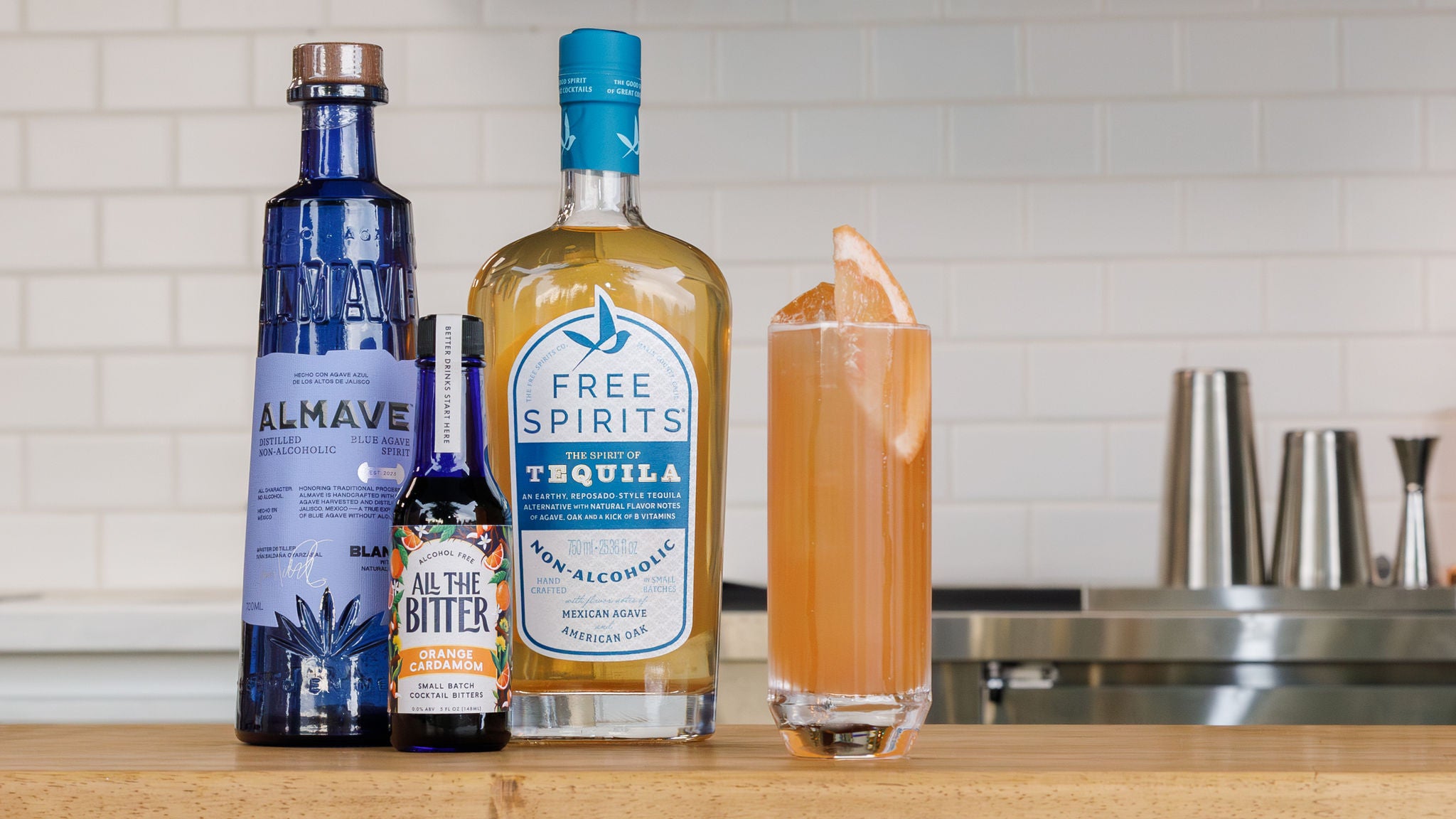 Photograph of a paloma mocktail made with non-alcoholic tequila and orange bitters.