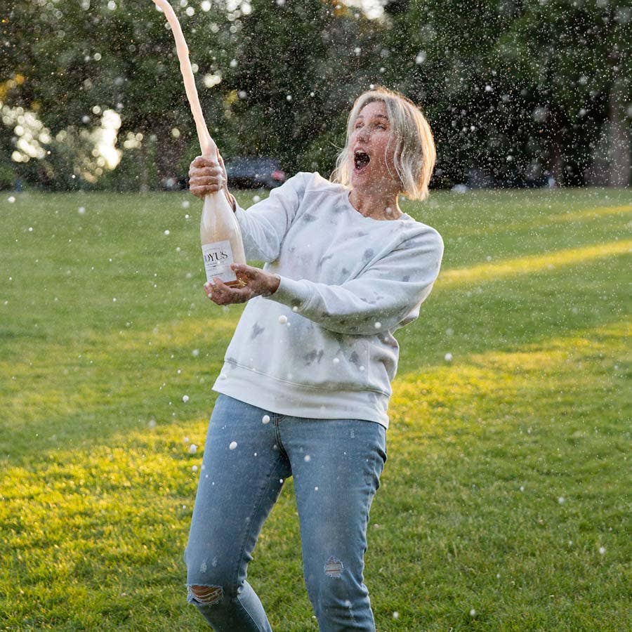 Jess from Joyus popping a bottle of sparkling wine!