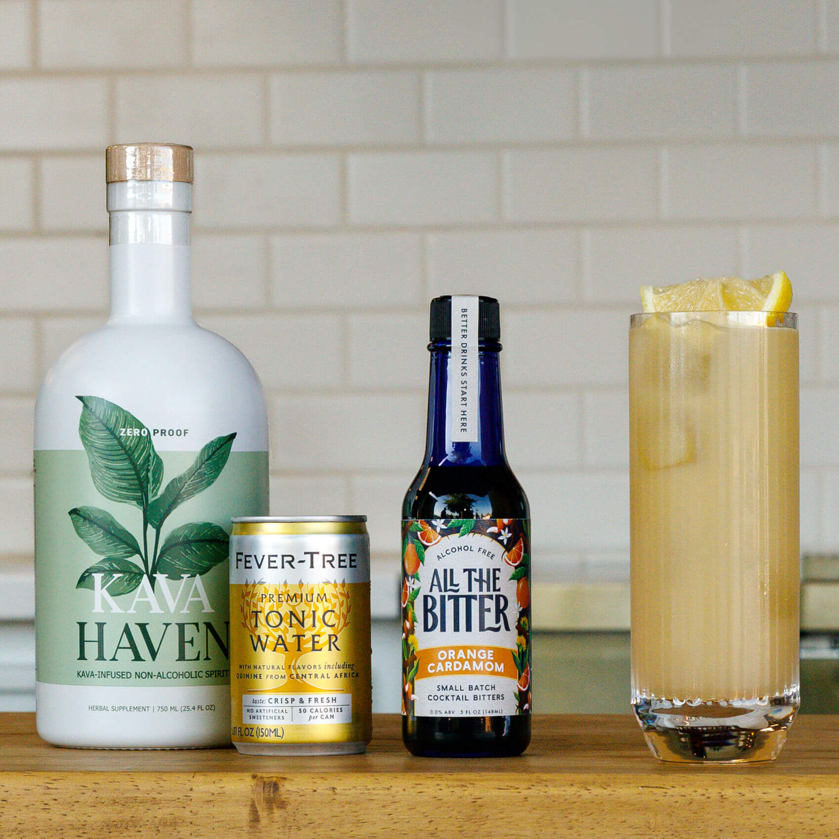 Beverages including Kava Haven, Fever-Tree tonic water, All The Bitter, and a mocktail on a wooden surface.